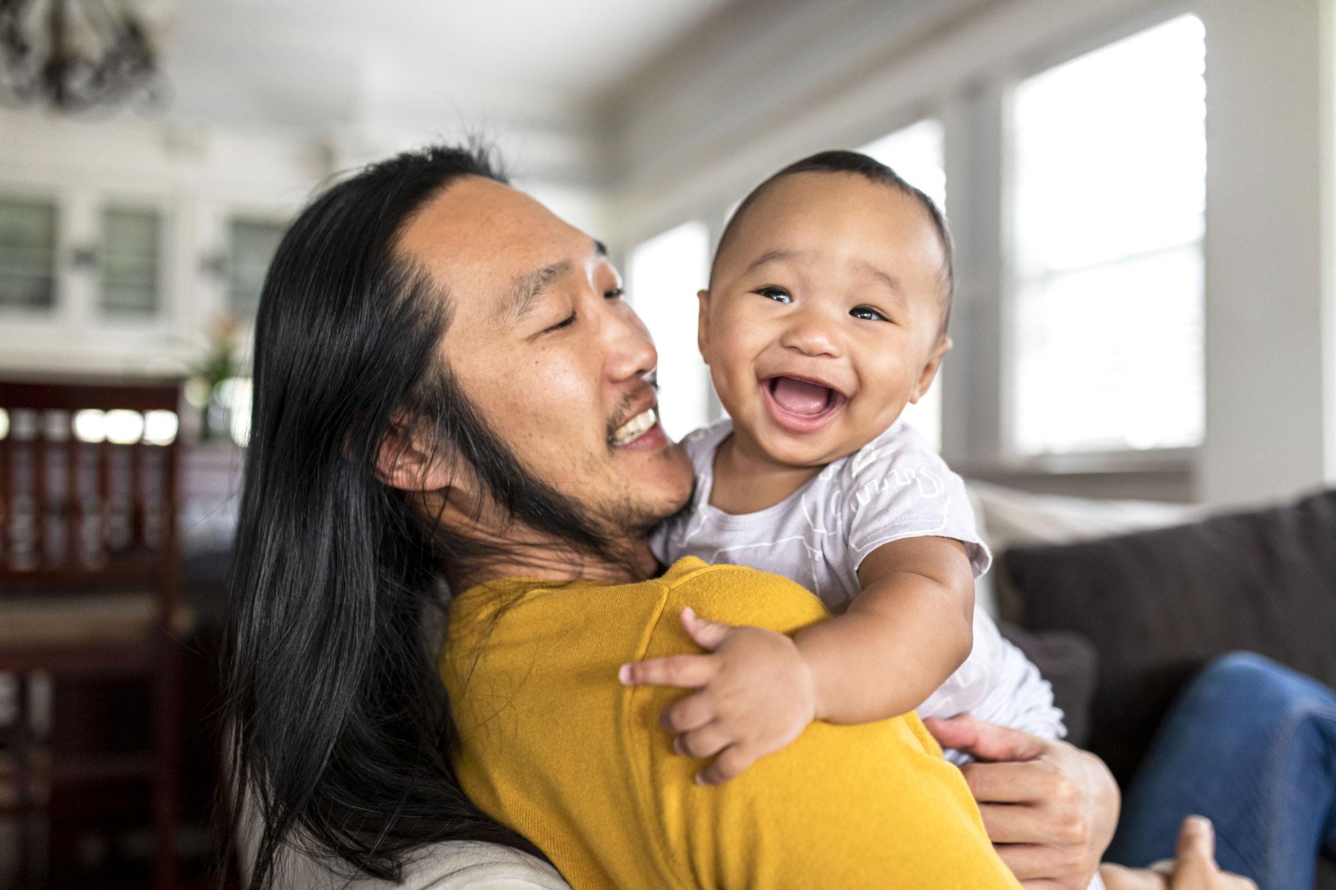 asian-american-father-hugging-his-son